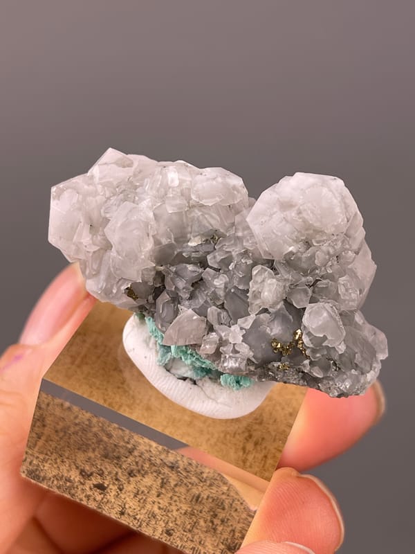 Calcite specimen from Longyan, Fujian, China highlighting pale gray calcite with brassy pyrite