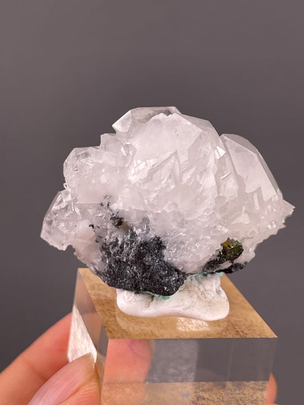Calcite specimen from Longyan, Fujian, China featuring clear calcite cluster over dark matrix
