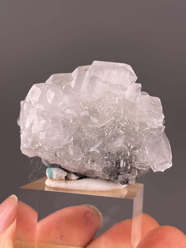 Calcite specimen from Longyan, Fujian, China presenting clear calcite cluster over dark matrix