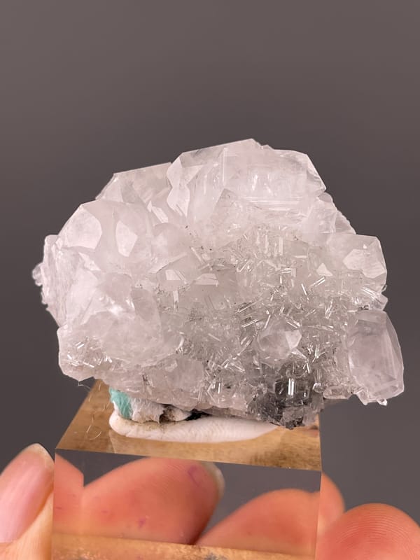 Clear calcite cluster over dark matrix visible on calcite specimen from Longyan, Fujian, China