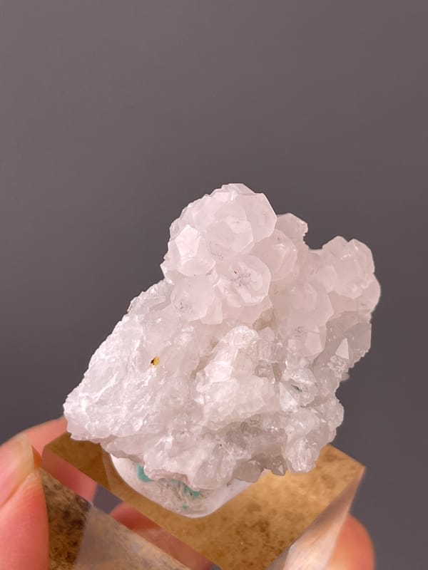 Pale pink blocky calcite cluster visible on calcite specimen from Longyan, Fujian, China