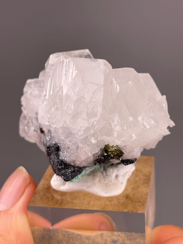 Calcite specimen from Longyan, Fujian, China highlighting clear calcite cluster over dark matrix