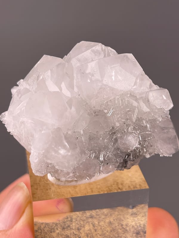Calcite specimen from Longyan, Fujian, China bearing clear calcite cluster over dark matrix