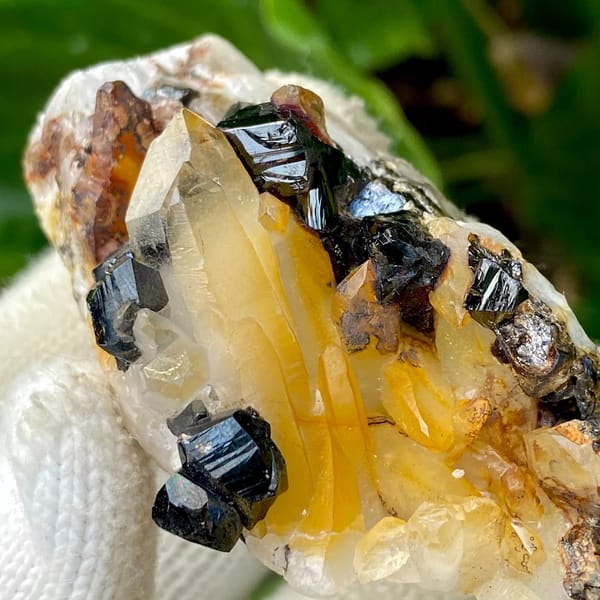 Glossy black cassiterite crystals with honey citrine on white matrix from Yunnan, China, view 5 of 9