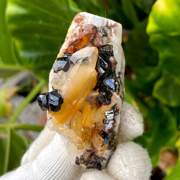 Glossy black cassiterite crystals with honey citrine on white matrix from Yunnan, China, view 9 of 9