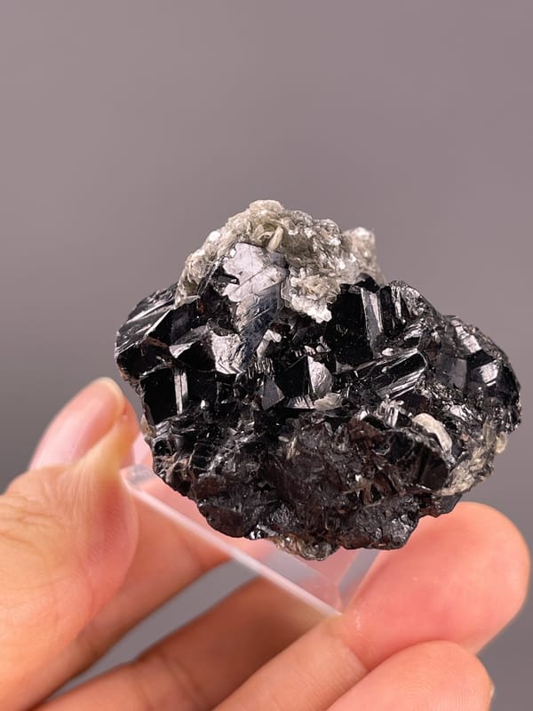 Cassiterite from Xuebaoding, China: upper view across the black crystalline cluster.