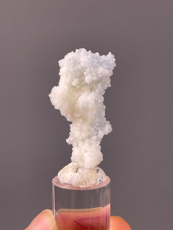 Celestite specimen from Longyan, Fujian, China featuring white stalactitic drusy mass