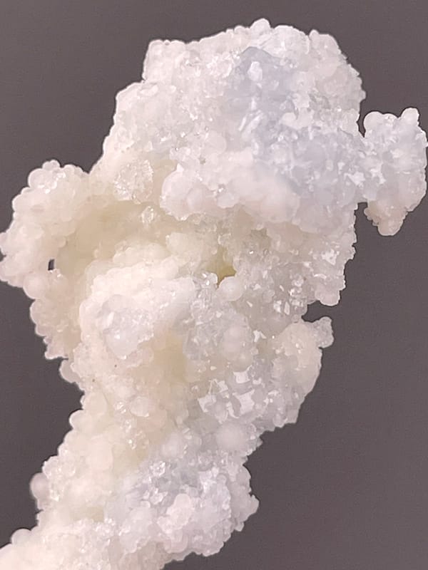 Celestite specimen from Longyan, Fujian, China, characterized by white stalactitic drusy mass