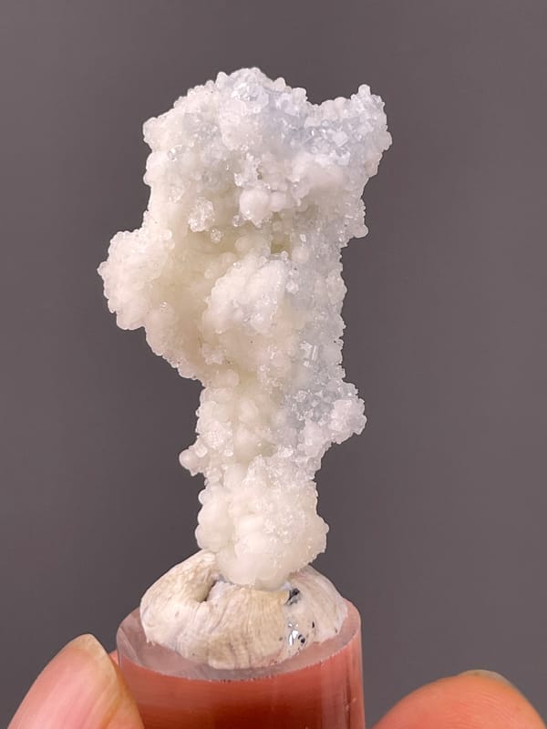 Celestite specimen from Longyan, Fujian, China showcasing white stalactitic drusy mass