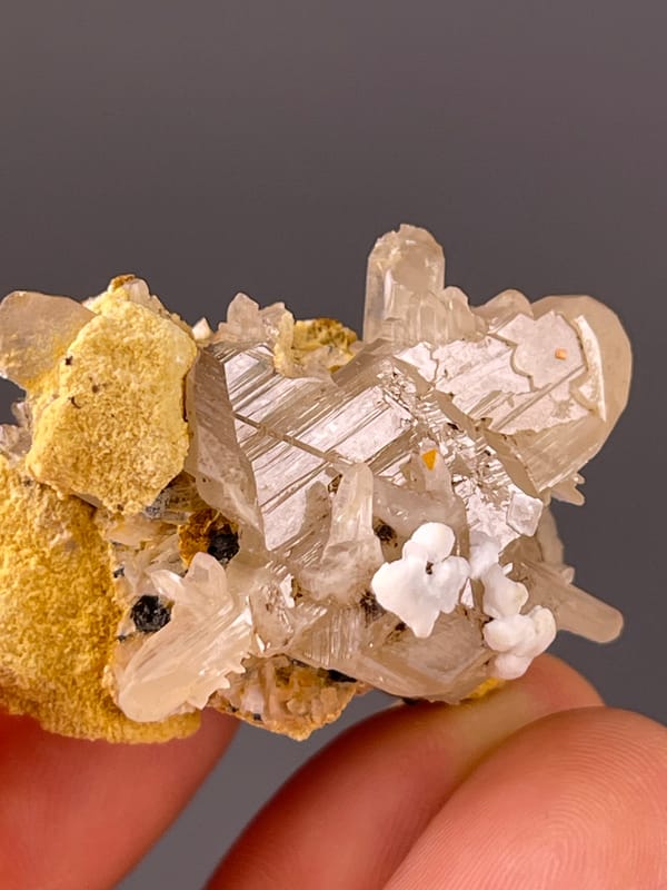 Cerussite specimen from Iran bearing colorless striated prisms
