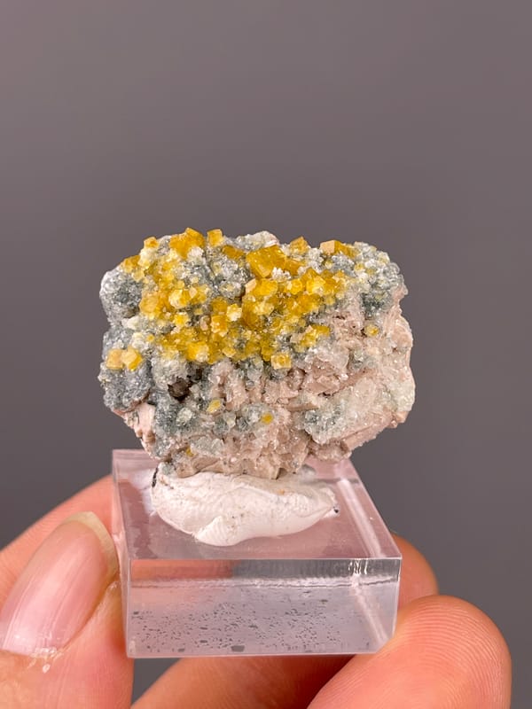 Chabazite specimen from Fujian, China featuring yellow short-prismatic crystal coating