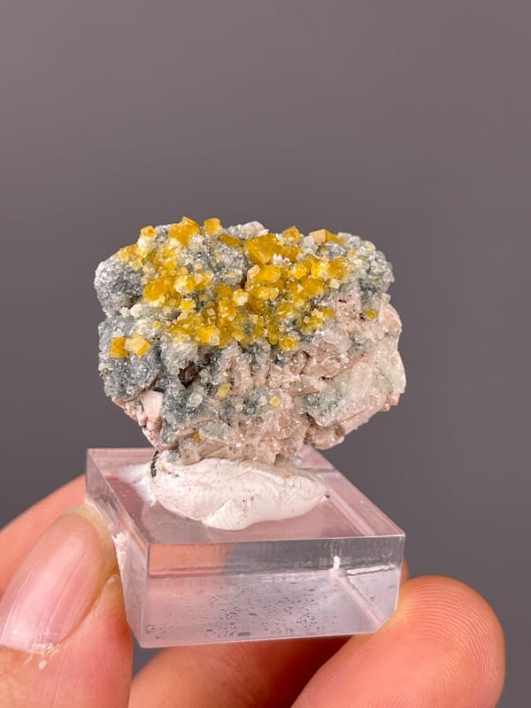 Chabazite specimen from Fujian, China showing yellow short-prismatic crystal coating