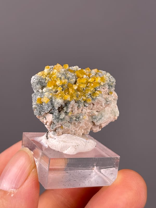 Chabazite specimen from Fujian, China, defined by yellow short-prismatic crystal coating