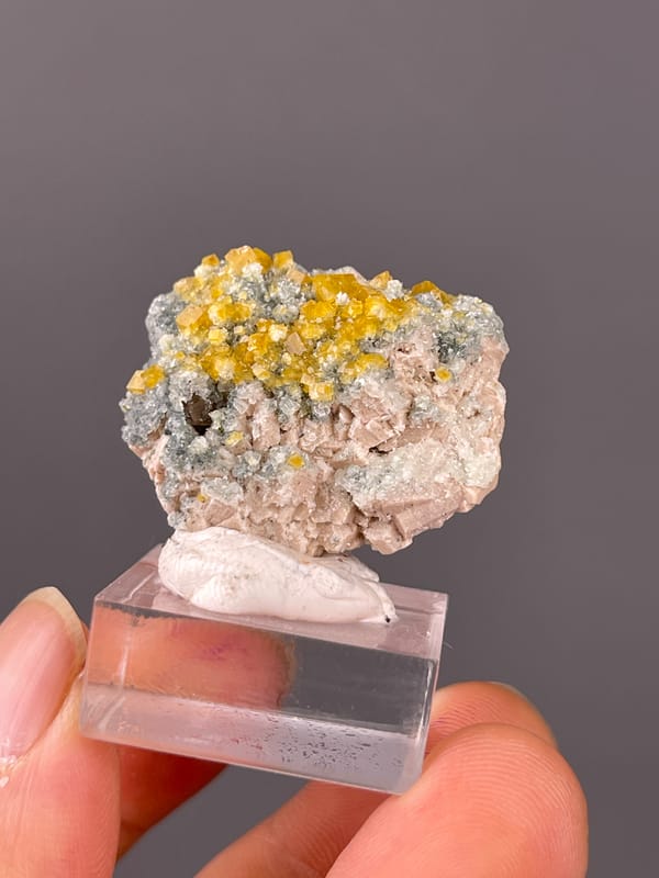 Yellow short-prismatic crystal coating visible on chabazite specimen from Fujian, China