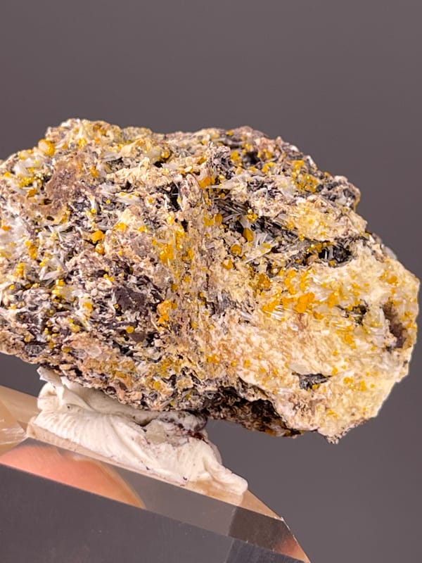 Natural Chabazite specimen from Fujian, China with dark blades with yellow-orange coating