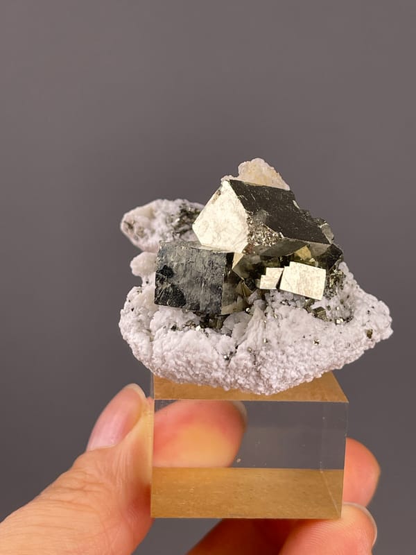 Chalcopyrite from Shangbao, Hunan, China: front angle showing pale material on larger metallic crystals.
