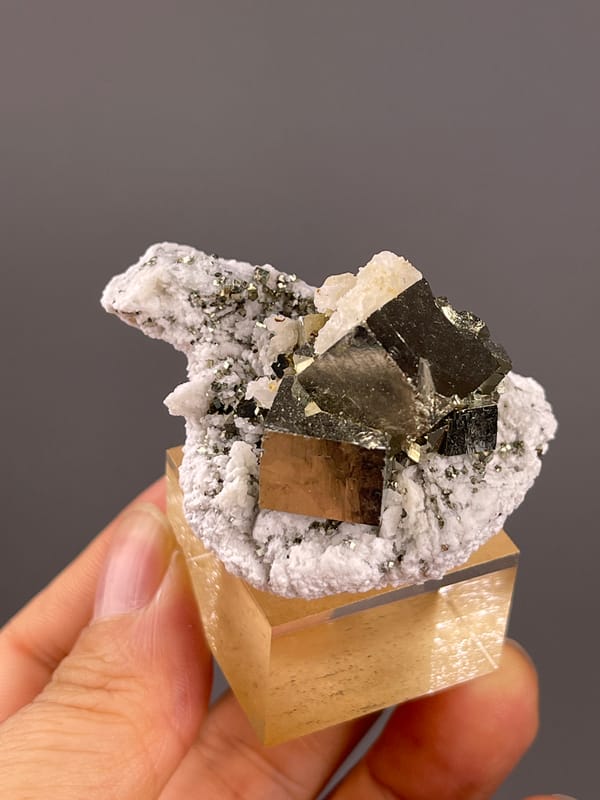 Chalcopyrite from Shangbao, Hunan, China: top view showing stacked metallic blocks on white growths.