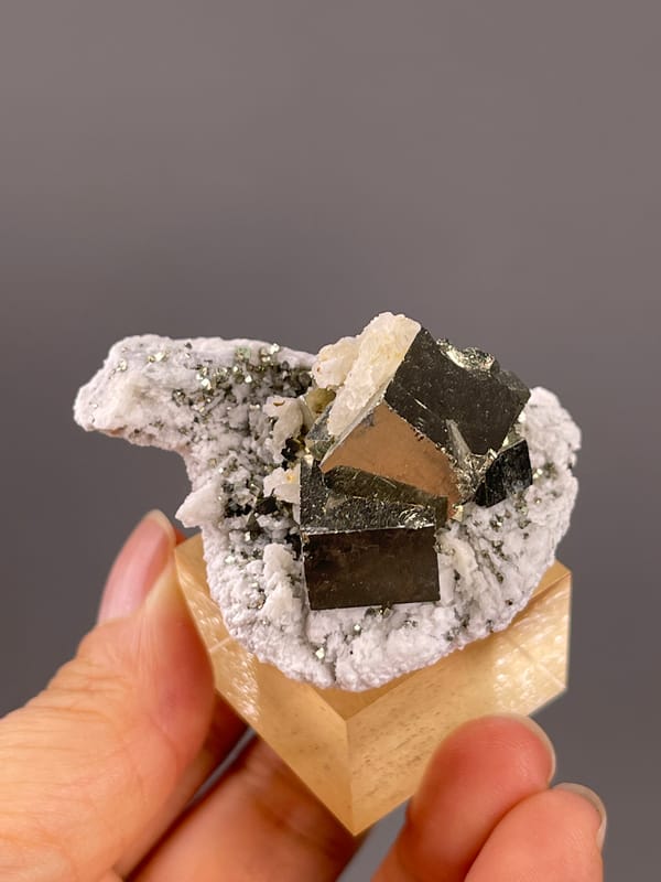 Chalcopyrite from Shangbao, Hunan, China: angled top view with a bright triangular reflection.
