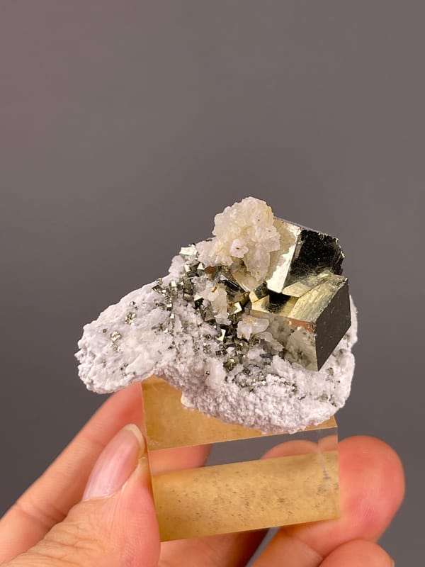 Chalcopyrite from Shangbao, Hunan, China: reverse angle of pale growths on a large brassy block.