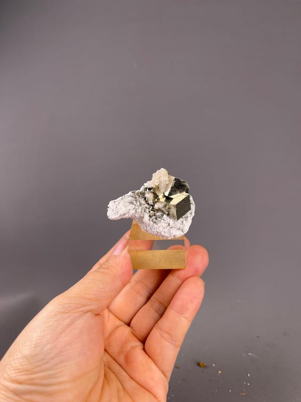 Chalcopyrite from Shangbao, Hunan, China: whole association mounted on a clear display cube.