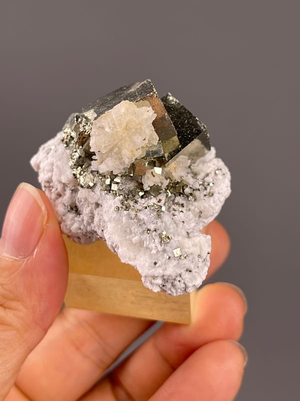 Chalcopyrite from Shangbao, Hunan, China: rotated view exposing small metallic grains around pale growths.