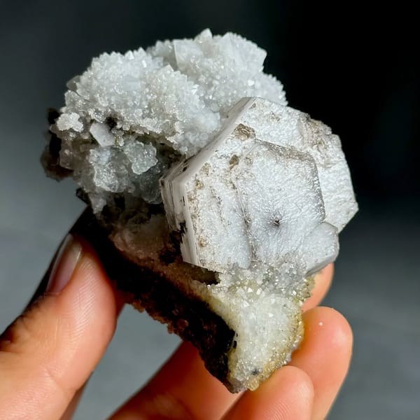 Hexagonal chocolate-sandwich calcite, from Fujian, China, front view in daylight, view 3 of 11