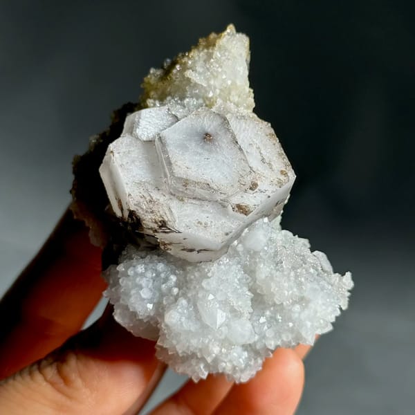 Hexagonal chocolate-sandwich calcite, from Fujian, China, front view in daylight, view 4 of 11