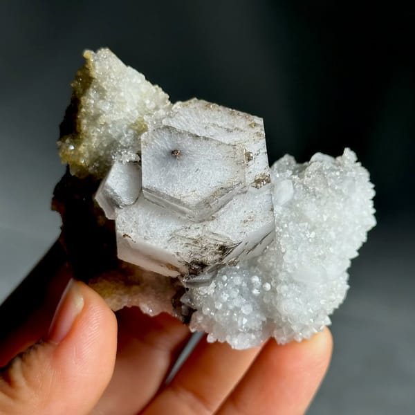 Hexagonal chocolate-sandwich calcite, from Fujian, China, front view in daylight, view 5 of 11