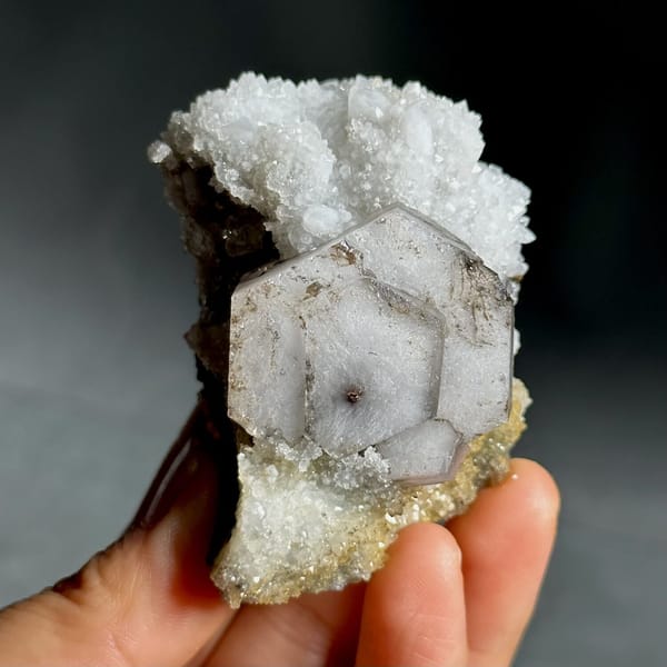 Hexagonal chocolate-sandwich calcite, from Fujian, China, front view in daylight, view 7 of 11