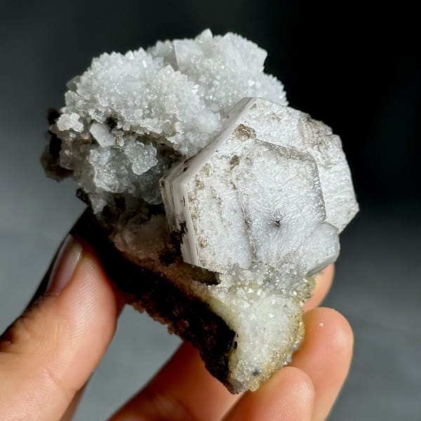Hexagonal chocolate-sandwich calcite, from Fujian, China, front view in daylight, view 8 of 11