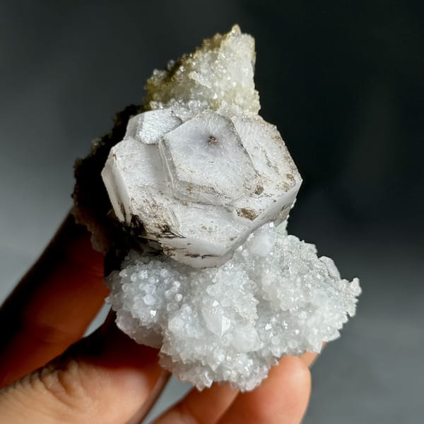 Hexagonal chocolate-sandwich calcite, from Fujian, China, front view in daylight, view 9 of 11