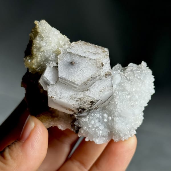 Hexagonal chocolate-sandwich calcite, from Fujian, China, front view in daylight, view 10 of 11