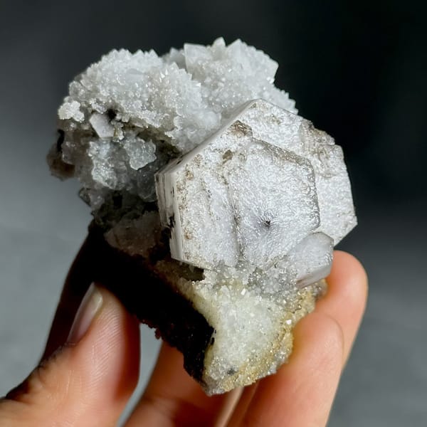 Hexagonal chocolate-sandwich calcite, from Fujian, China, front view in daylight, view 11 of 11