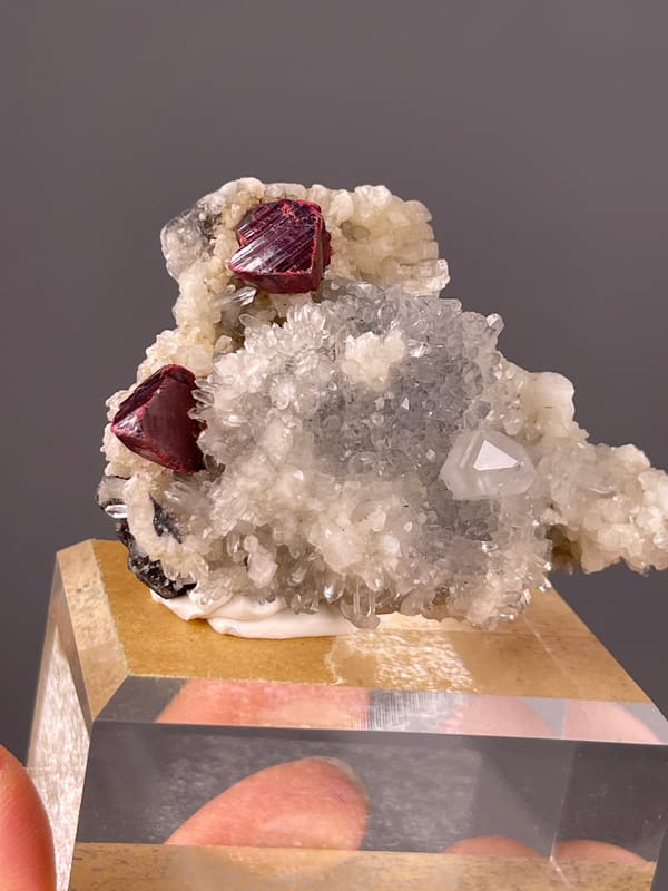 Cinnabar specimen from Maxianxi, Hunan, China, defined by red-brown crystals on white druse