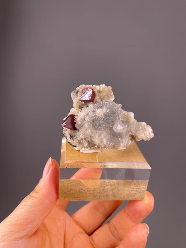 Cinnabar specimen from Maxianxi, Hunan, China, characterized by red-brown crystals on white druse