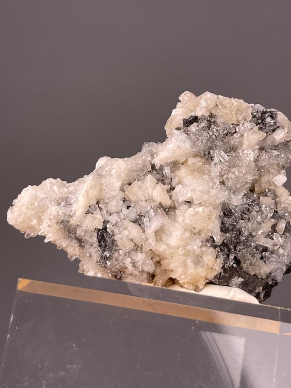 Cinnabar specimen from Maxianxi, Hunan, China bearing red-brown crystals on white druse