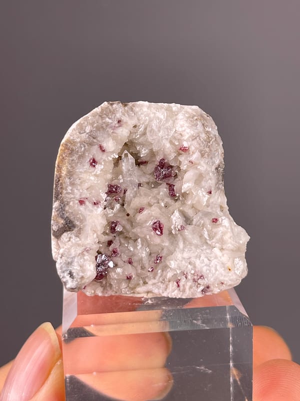 Cinnabar specimen from Hunan, China showing reddish crystals in white matrix