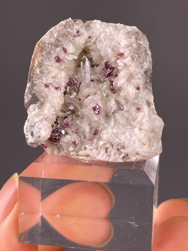 Cinnabar specimen from Hunan, China, defined by reddish crystals in white matrix
