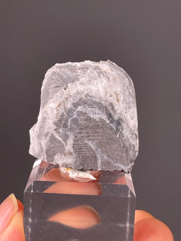 Cinnabar specimen from Hunan, China highlighting reddish crystals in white matrix