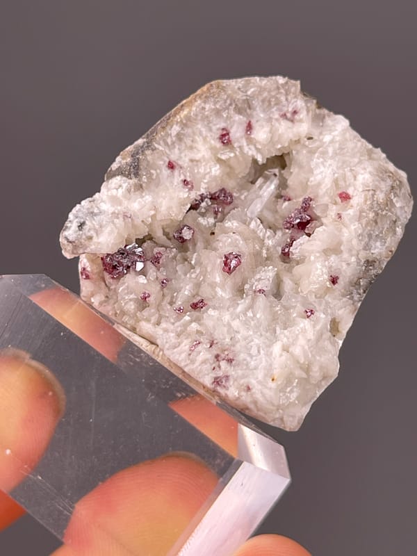 Cinnabar specimen from Hunan, China, characterized by reddish crystals in white matrix