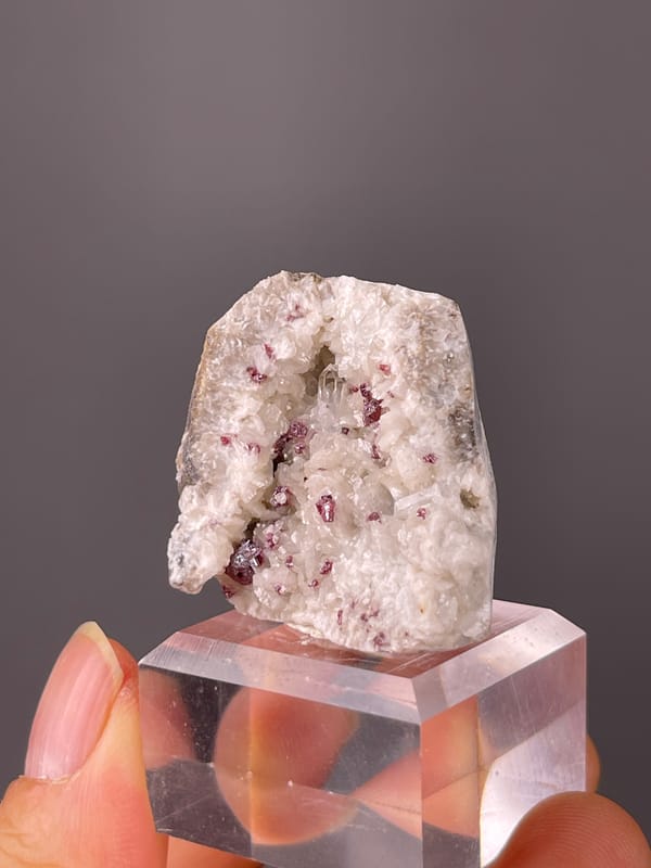 Cinnabar specimen from Hunan, China bearing reddish crystals in white matrix
