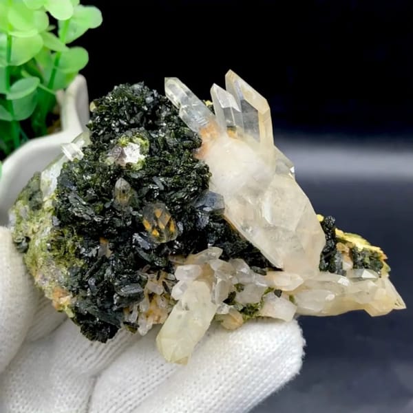 Clear quartz points rising from dark green epidote from Sichuan, China
