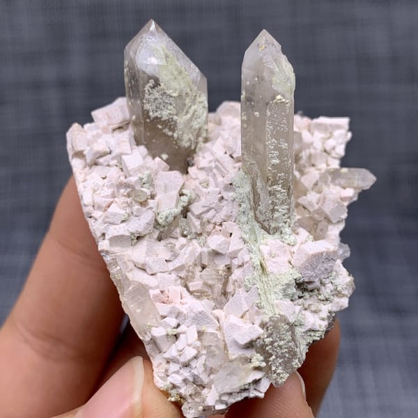 Two clear quartz points on pink feldspar from Fujian, China, view 11 of 11