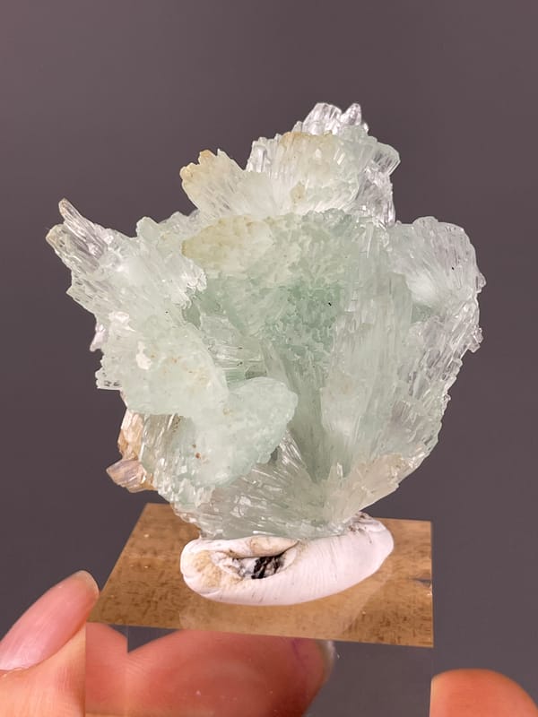 Clustered Blue Aragonite specimen from Yunnan, China featuring pale green radiating fan cluster
