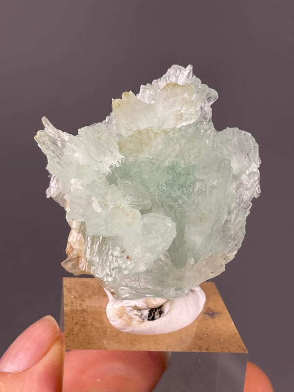 Clustered Blue Aragonite specimen from Yunnan, China showing pale green radiating fan cluster