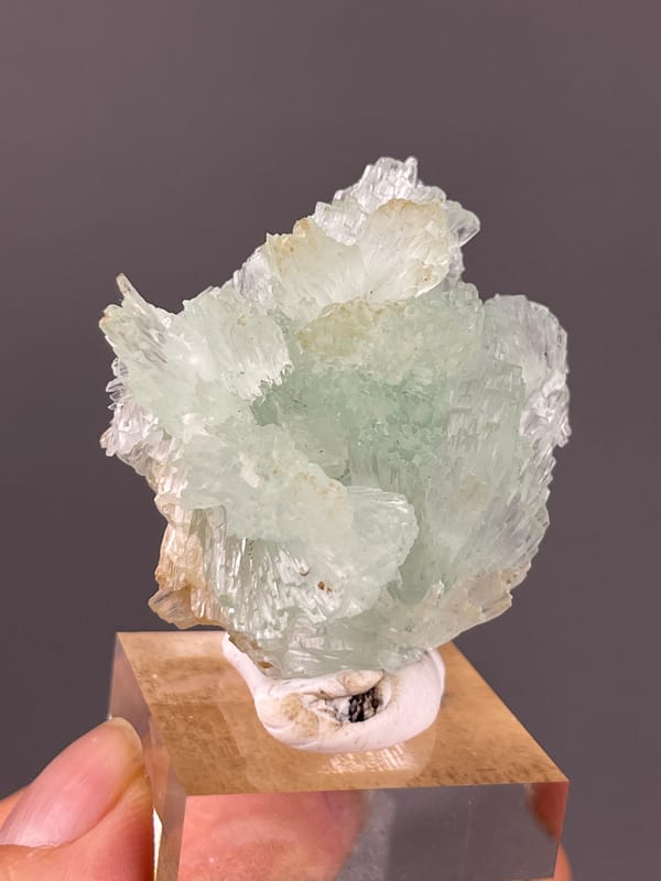 Clustered Blue Aragonite specimen from Yunnan, China, defined by pale green radiating fan cluster