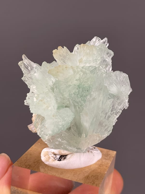 Clustered Blue Aragonite specimen from Yunnan, China displaying pale green radiating fan cluster