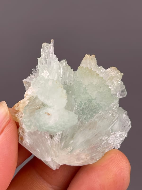 Clustered Blue Aragonite specimen from Yunnan, China, characterized by pale green radiating fan cluster