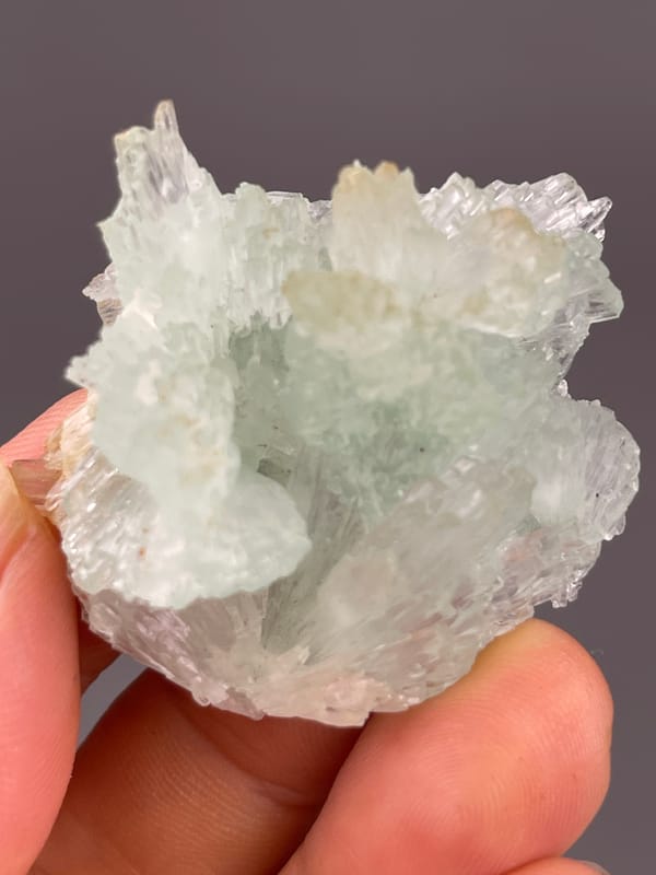 Clustered Blue Aragonite specimen from Yunnan, China bearing pale green radiating fan cluster