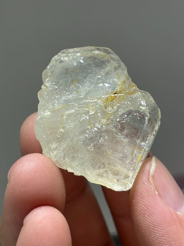 Colourless aquamarine crystal with golden staining from Xuebaoding, Sichuan, China, view 3 of 5